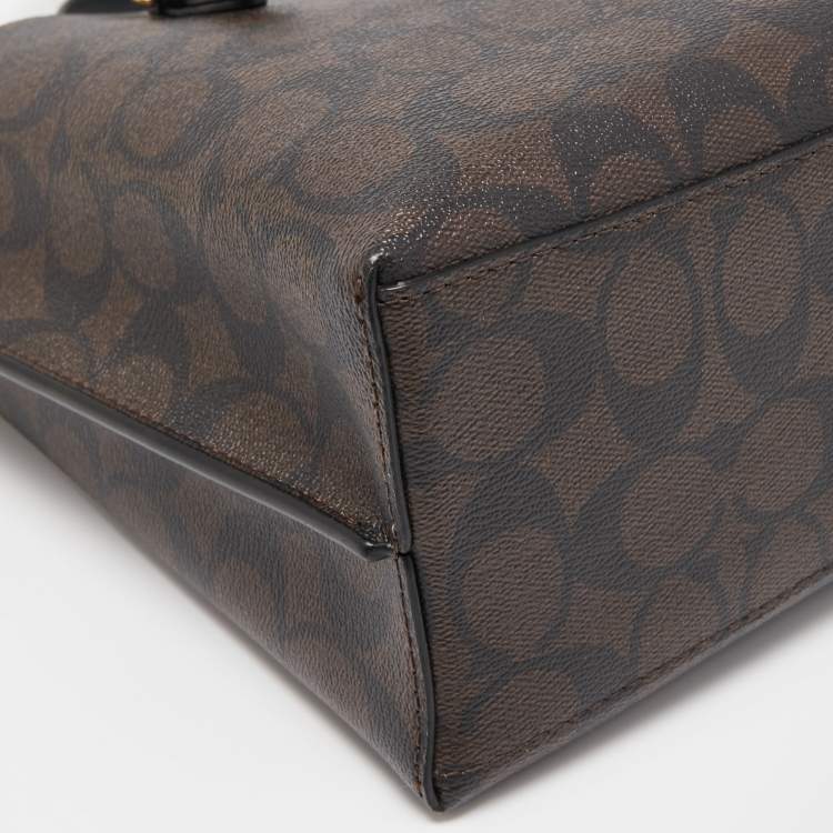 Pre Owned Coach Brown/Black Signature Coated Canvas Tatum Caryall Tote