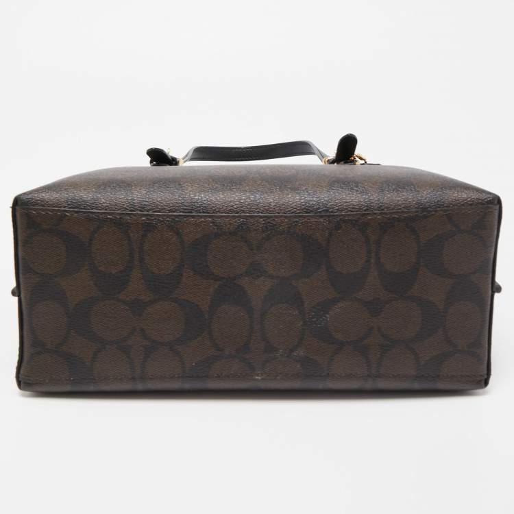 Pre Owned Coach Brown/Black Signature Coated Canvas Tatum Caryall Tote