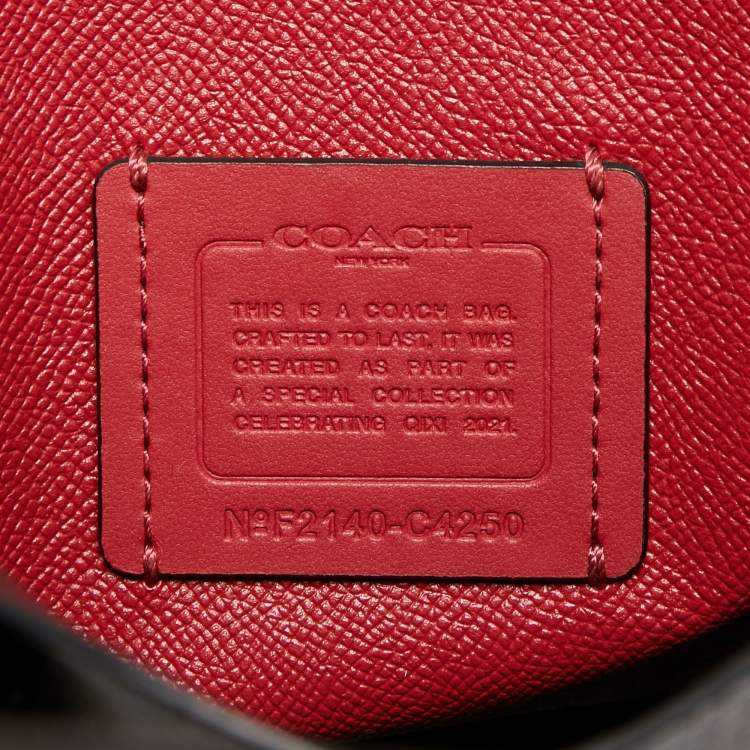 Pre Owned Coach Brown/Black Signature Coated Canvas Tatum Caryall Tote