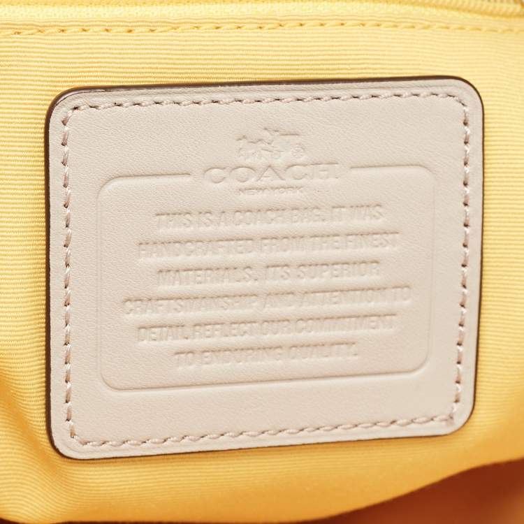 Pre Owned Coach White/Taupe Signature Coated Canvas and Leather City Tote