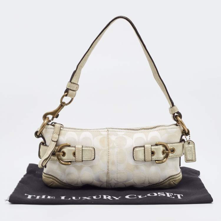 Pre Owned Coach Pale Gold/Beige Signature Canvas and Leather Baguette 
