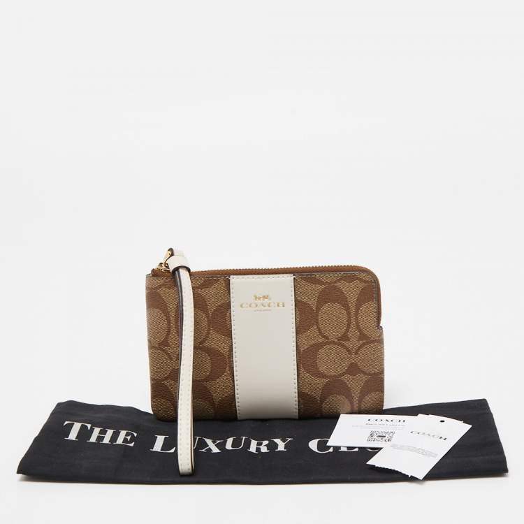 Pre Owned Coach Beige Signature Canvas and Leather Corner Zip Wristlet