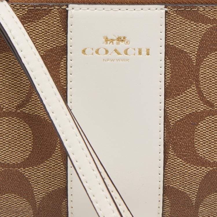 Pre Owned Coach Beige Signature Canvas and Leather Corner Zip Wristlet