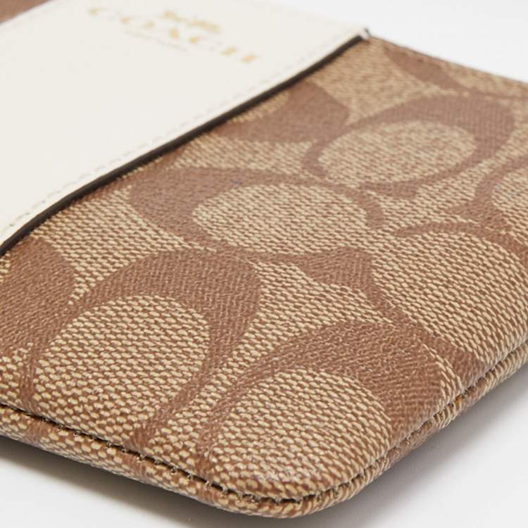 Pre Owned Coach Beige Signature Canvas and Leather Corner Zip Wristlet