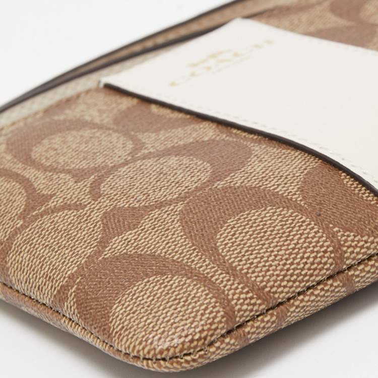 Pre Owned Coach Beige Signature Canvas and Leather Corner Zip Wristlet