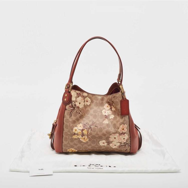 Pre Owned Coach Beige/Brown Signature Prairie Floral Canvas and Leather Edie 31 Satchel