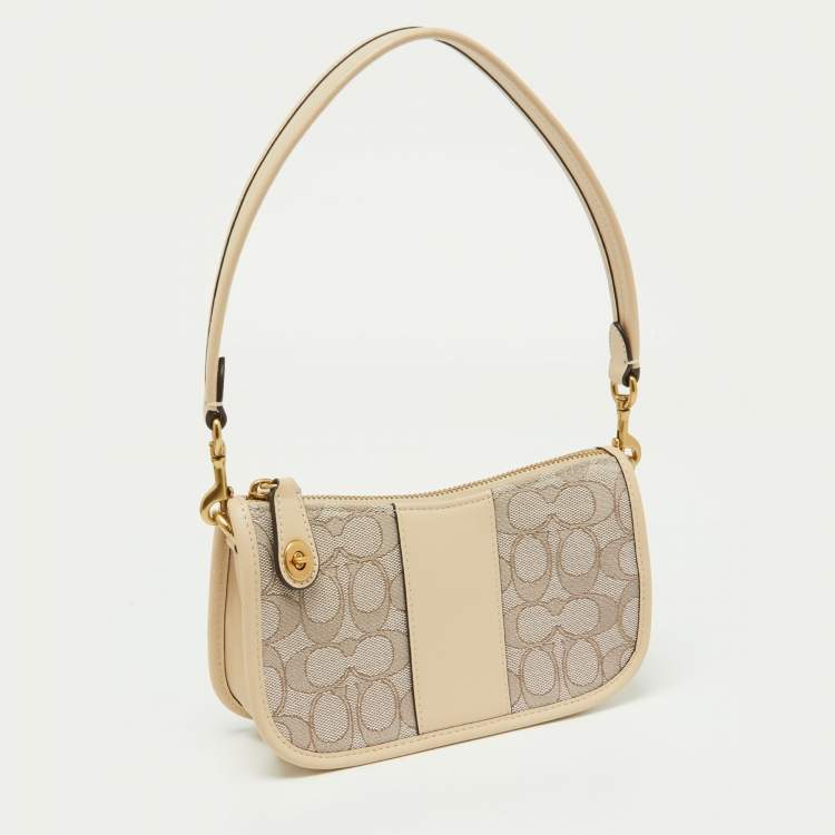 مملوكة مسبقًا Coach Beige/Cream Signature Canvas and Leather Swinger Pochette Bag