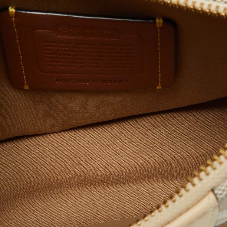 مملوكة مسبقًا Coach Beige/Cream Signature Canvas and Leather Swinger Pochette Bag