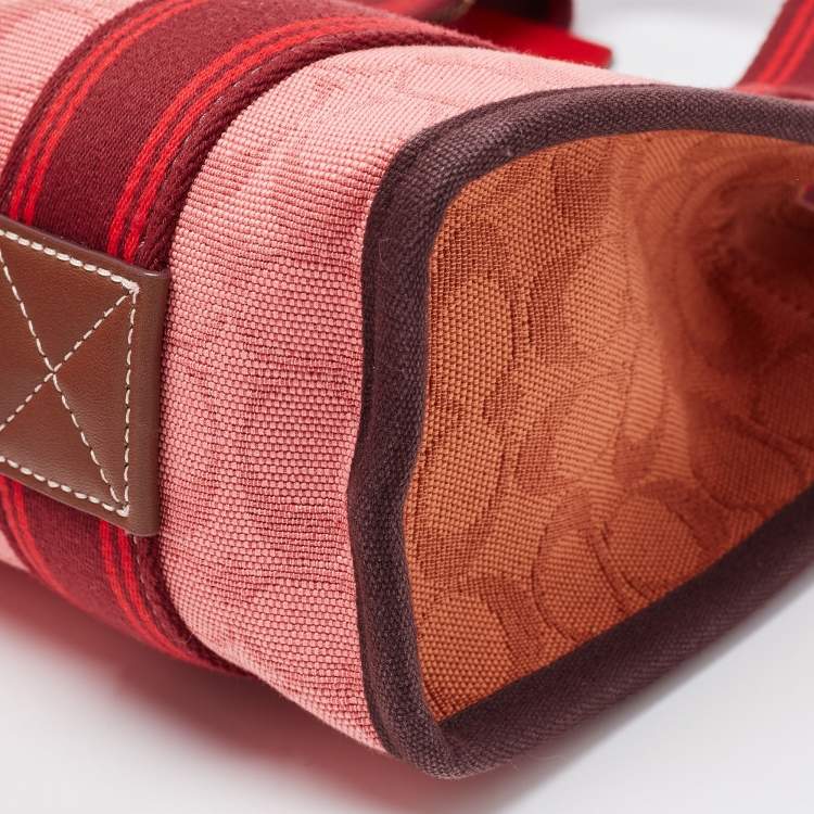 Pre Owned Coach Red/Pink Signature Canvas Spin 27 Tote