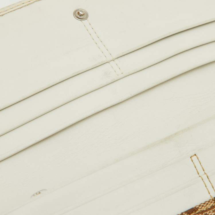 Pre Owned Coach Beige/White Signature Canvas and Leather Buckle Detail Continental Wallet