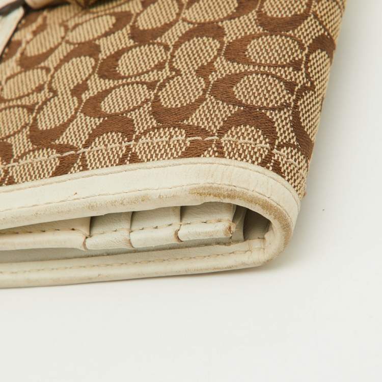 Pre Owned Coach Beige/White Signature Canvas and Leather Buckle Detail Continental Wallet