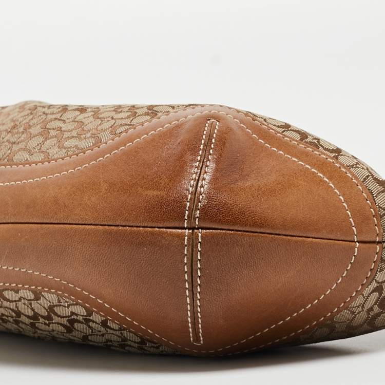 Pre Owned Coach Beige/Brown Signature Canvas and Leather Soho Hobo