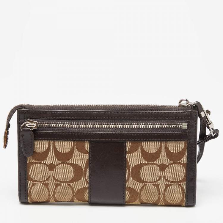 Pre Owned Coach Brown/Beige Signature Canvas and Leather Zip Wristlet Pouch