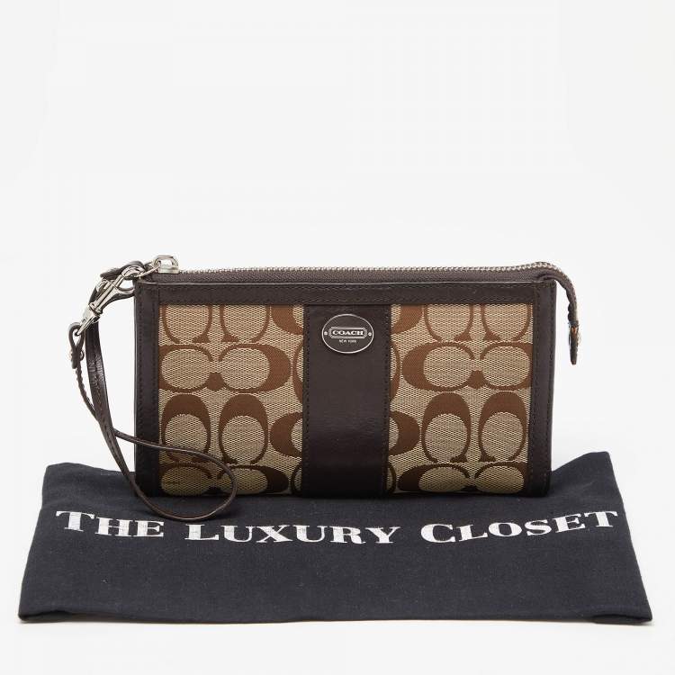 Pre Owned Coach Brown/Beige Signature Canvas and Leather Zip Wristlet Pouch