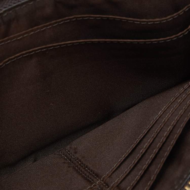Pre Owned Coach Brown/Beige Signature Canvas and Leather Zip Wristlet Pouch