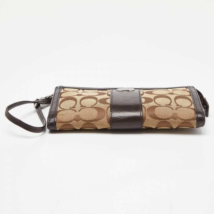 Pre Owned Coach Brown/Beige Signature Canvas and Leather Zip Wristlet Pouch