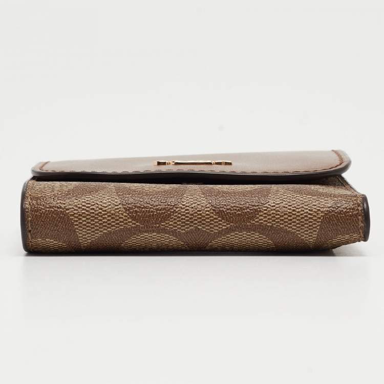 Pre Owned Coach Beige/Brown Signature Coated Canvas and Leather Trifold Wallet