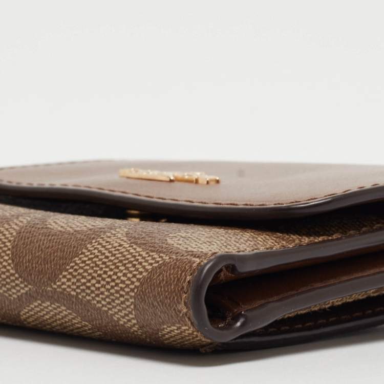 Pre Owned Coach Beige/Brown Signature Coated Canvas and Leather Trifold Wallet