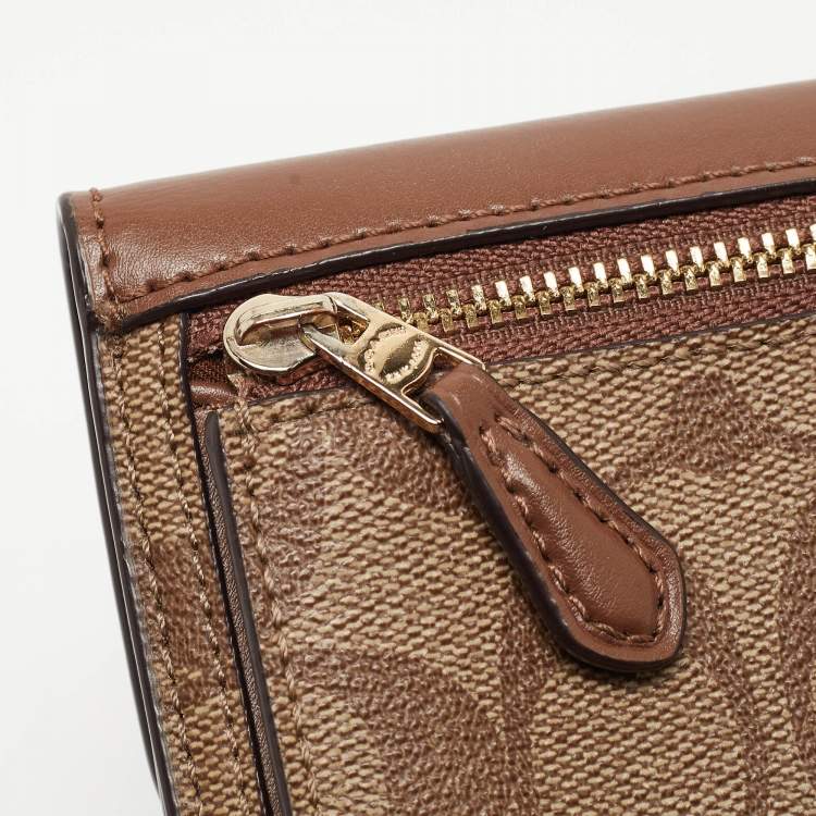 Pre Owned Coach Beige/Brown Signature Coated Canvas and Leather Trifold Wallet