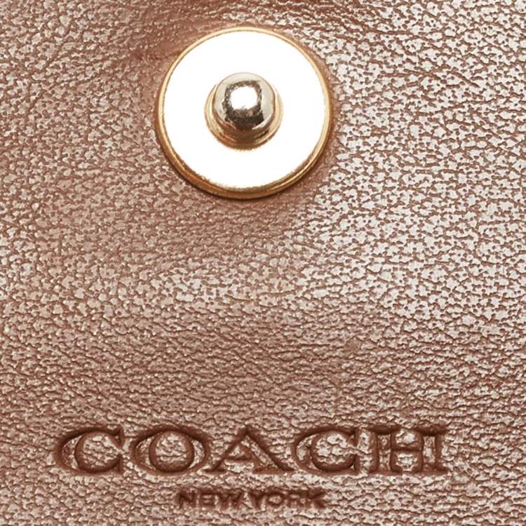 Pre Owned Coach Beige/Brown Signature Coated Canvas and Leather Trifold Wallet