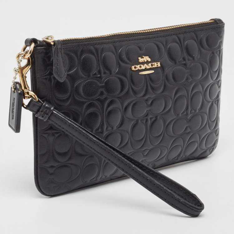 Pre Owned Coach Black Signature Embossed Leather Wristlet Pouch