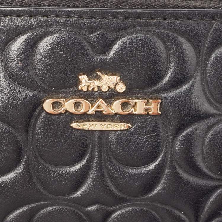 Pre Owned Coach Black Signature Embossed Leather Wristlet Pouch