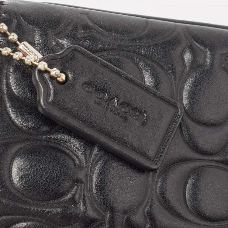 Pre Owned Coach Black Signature Embossed Leather Wristlet Pouch