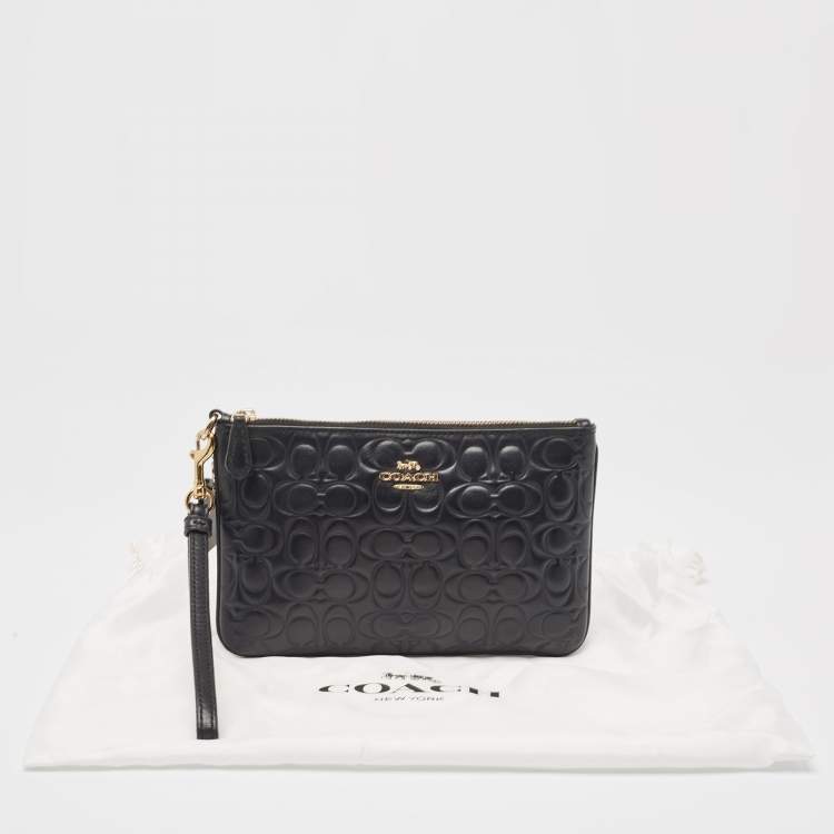 Pre Owned Coach Black Signature Embossed Leather Wristlet Pouch