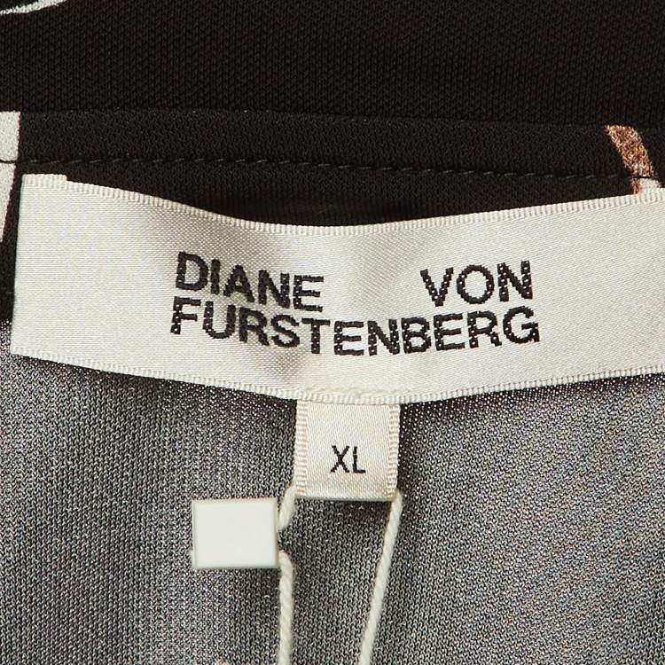 Pre Owned Diane Von Furstenberg Black Floating Face Print Jersey Wrap Around Bobbie Top XL 