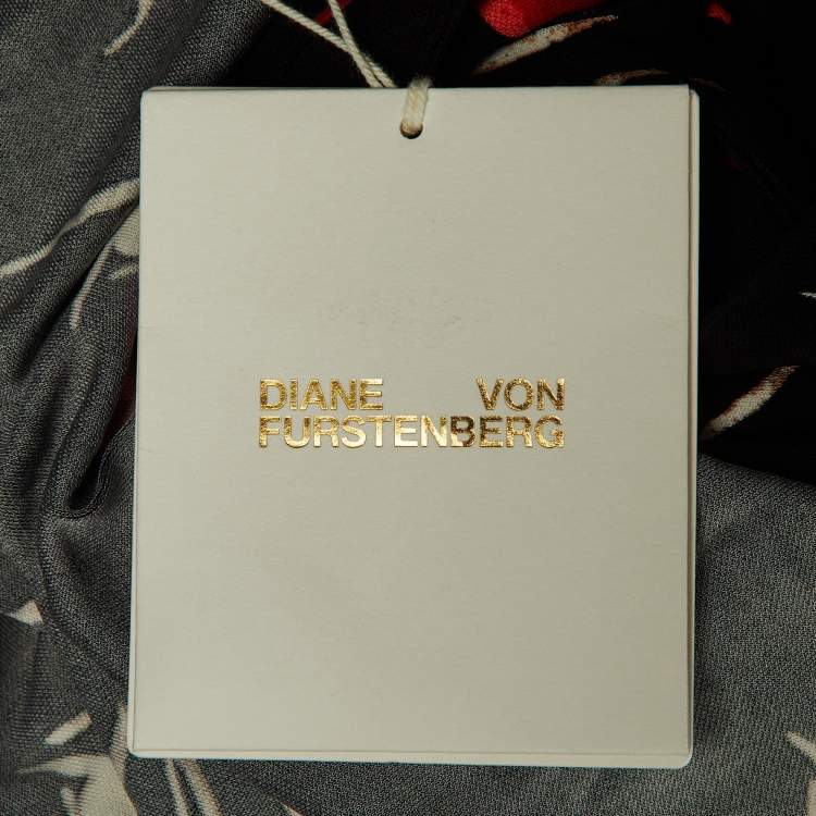 Pre Owned Diane Von Furstenberg Black Floating Face Print Jersey Wrap Around Bobbie Top XL 