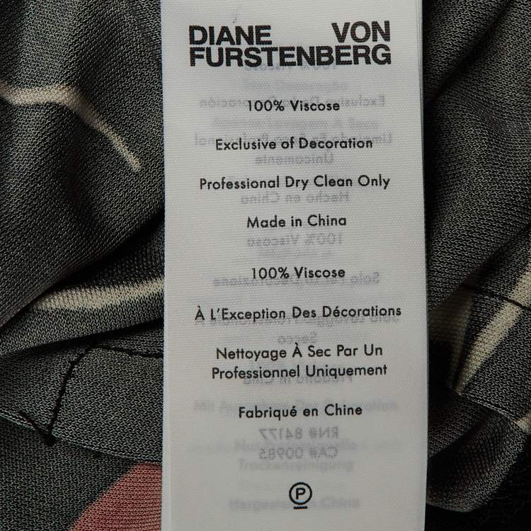 Pre Owned Diane Von Furstenberg Black Floating Face Print Jersey Wrap Around Bobbie Top XL 