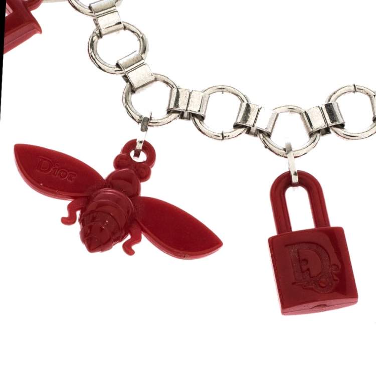 Pre Owned Dior Red Resin Multi Charm Silver Tone Link Bracelet