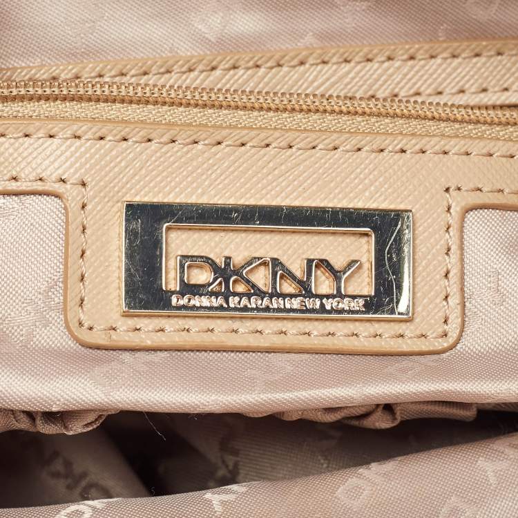 Pre Owned Dkny Cream/Beige Monogram Canvas and Leather Zip Tote