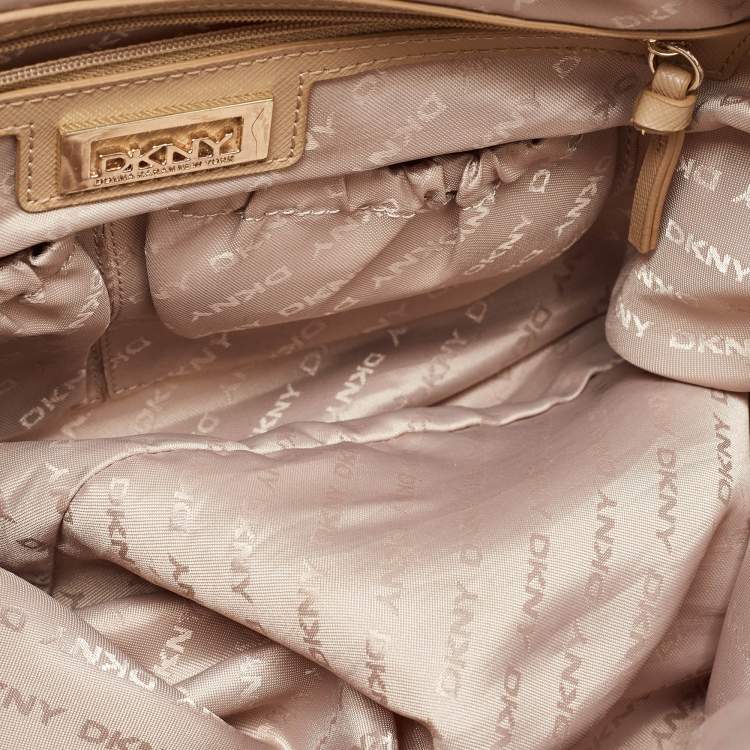 Pre Owned Dkny Cream/Beige Monogram Canvas and Leather Zip Tote