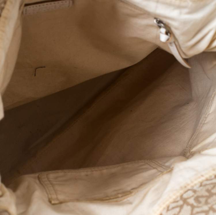 مملوكة مسبقًا DKNY Beige/White Signature Canvas and Leather Front Pocket Hobo
