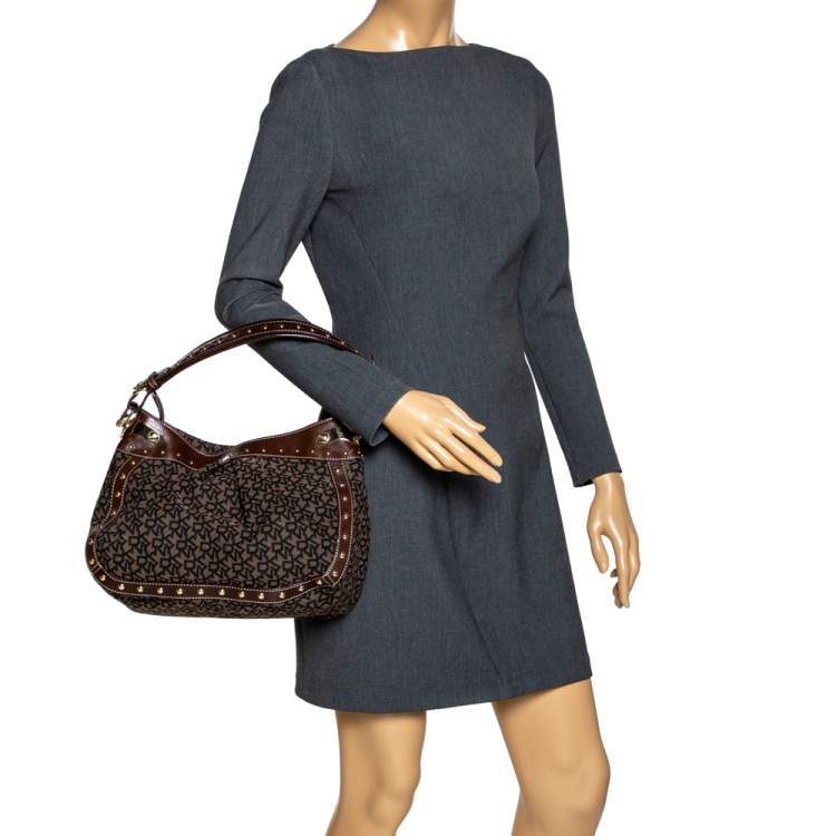 Pre Owned Dkny Brown/Black Signature Canvas and Leather Studded Hobo