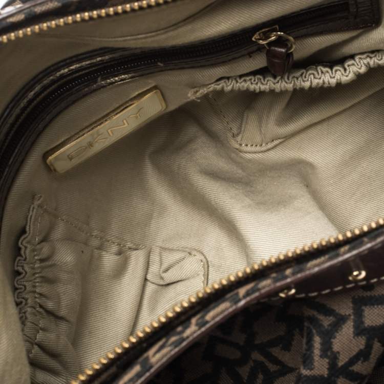 Pre Owned Dkny Brown/Black Signature Canvas and Leather Studded Hobo