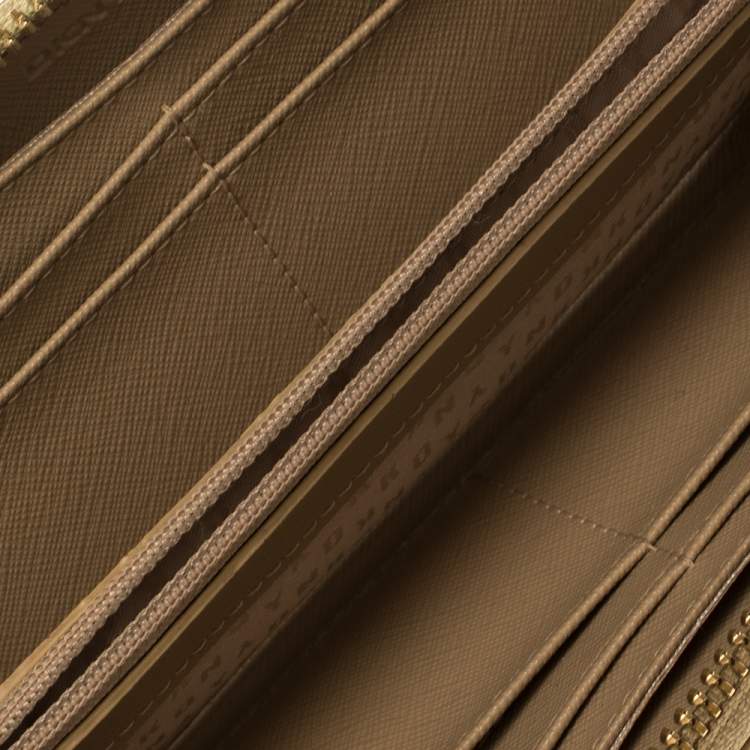 Pre Owned Dkny Metallic Beige Leather Zip Around Wallet