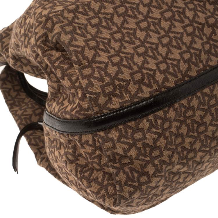Pre Owned Dkny Brown Monogram Canvas and Leather Studded Hobo