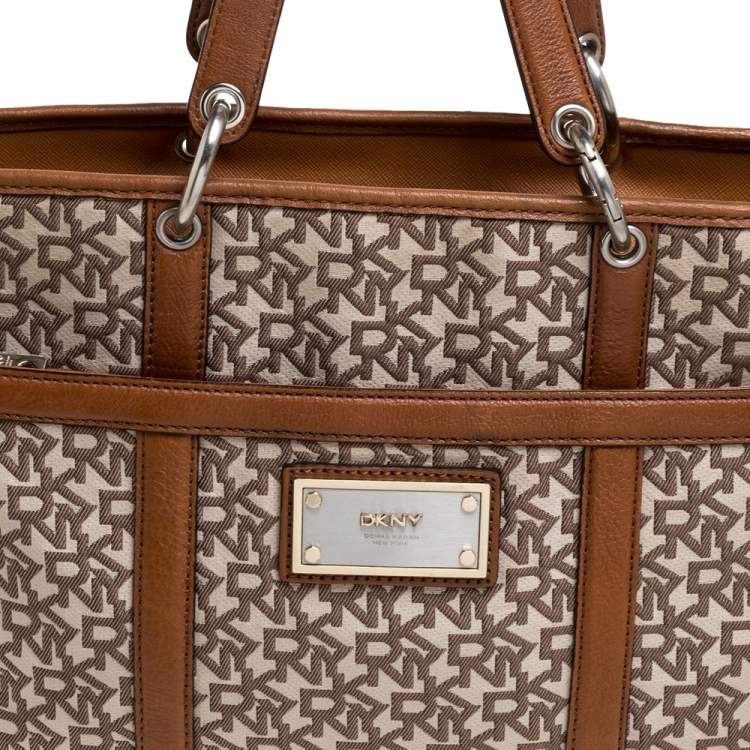 Pre Owned DKNY Brown/Beige Signature Canvas and Leather Front Pocket Zip Tote
