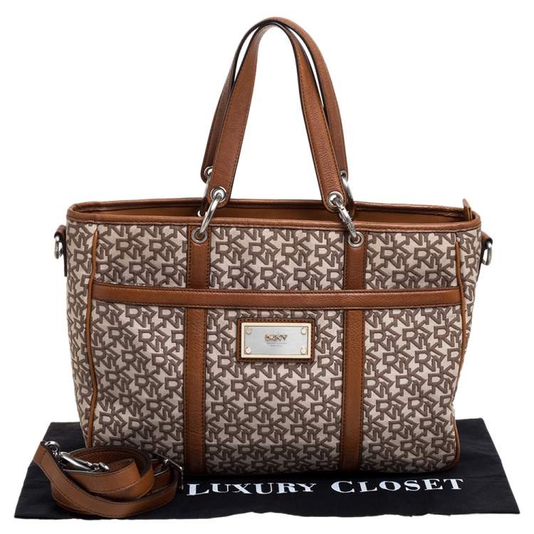 Pre Owned DKNY Brown/Beige Signature Canvas and Leather Front Pocket Zip Tote