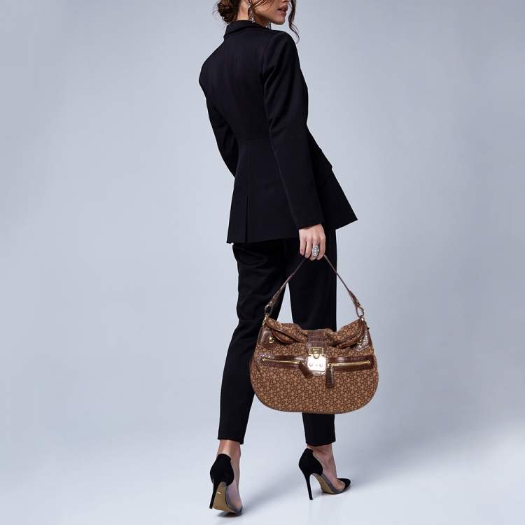 Pre Owned Dkny Brown Signature Canvas and Leather Hobo 