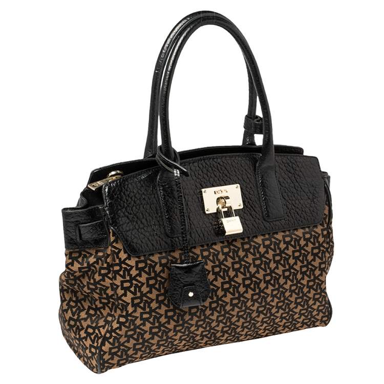 Pre Owned Dkny Black/Brown Signature Canvas and Leather Padlock Tote