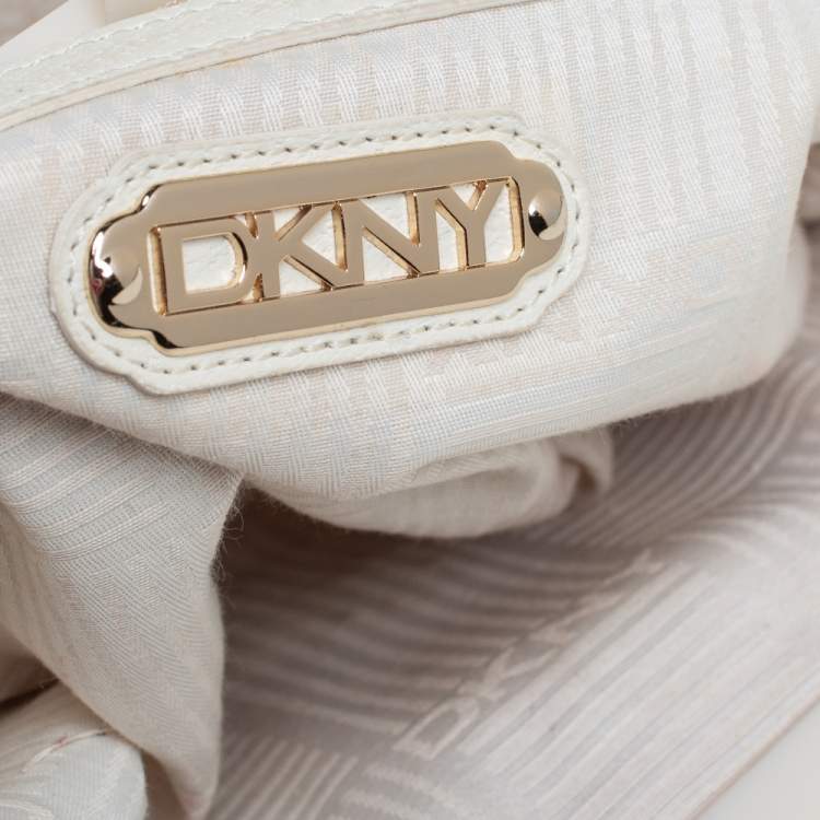 Pre Owned DKNY Beige/Orange Signature Canvas and Leather Kisslock Frame Clutch