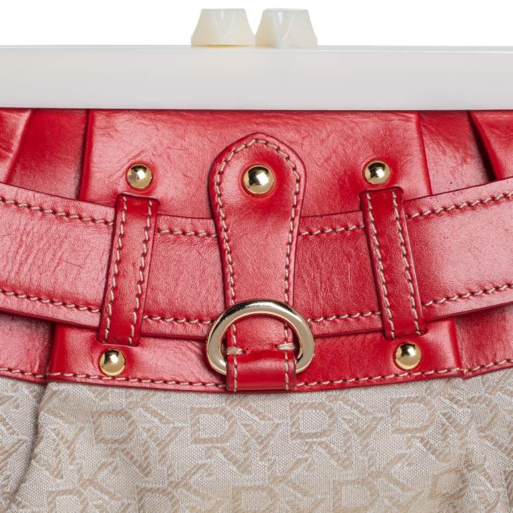 Pre Owned DKNY Beige/Orange Signature Canvas and Leather Kisslock Frame Clutch