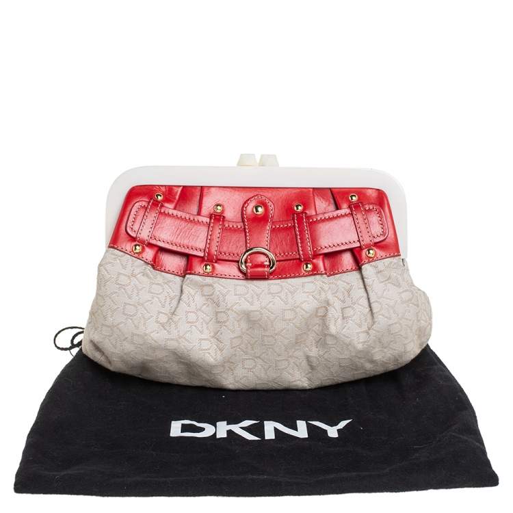 Pre Owned DKNY Beige/Orange Signature Canvas and Leather Kisslock Frame Clutch