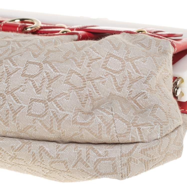 Pre Owned DKNY Beige/Orange Signature Canvas and Leather Kisslock Frame Clutch