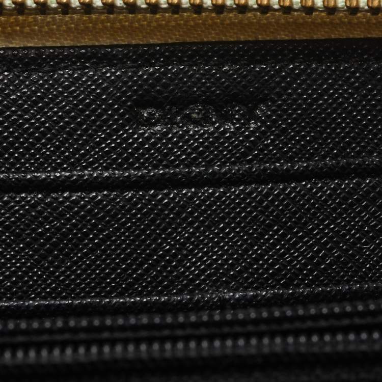 Pre Owned Dkny White Saffiano Leather Zip Around Continental Wallet 