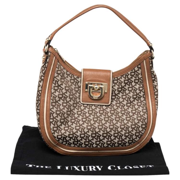 Pre Owned DKNY Brown Signature Canvas and Leather Trim Buckle Hobo