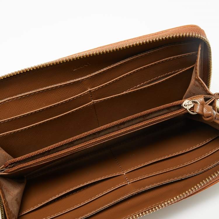 Pre Owned Dkny Tan/Beige Monogram Canvas and Leather Zip Around Continental Wallet